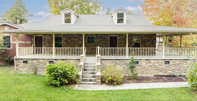 view of front of home featuring a front yard and covered porch