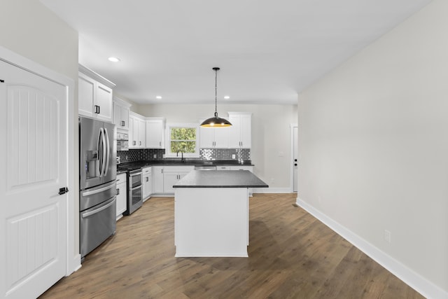 323 Conway St, Frankfort, KY 40601 - kitchen featuring white cabinets, dark countertops, recessed lighting, backsplash, and appliances with stainless steel finishes