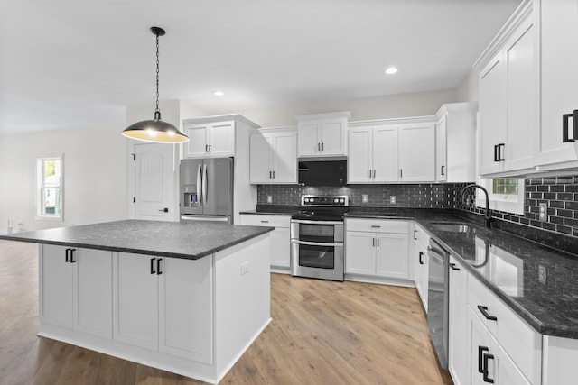 323 Conway St, Frankfort, KY 40601 - kitchen featuring light wood-type flooring, a sink, white cabinetry, and appliances with stainless steel finishes
