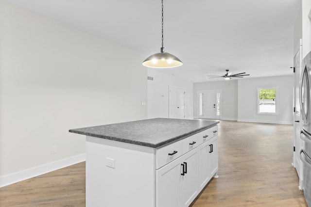 323 Conway St, Frankfort, KY 40601 - kitchen featuring dark countertops, light wood-style flooring, baseboards, and ceiling fan
