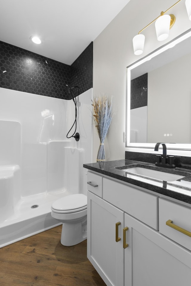 323 Conway St, Frankfort, KY 40601 - bathroom with toilet, recessed lighting, walk in shower, wood finished floors, and vanity
