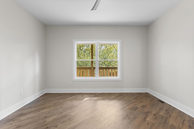 323 Conway St, Frankfort, KY 40601 - unfurnished room with baseboards, wood finished floors, visible vents, and a ceiling fan