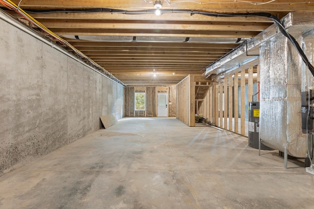 basement featuring electric water heater