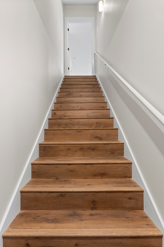 stairway featuring hardwood / wood-style flooring