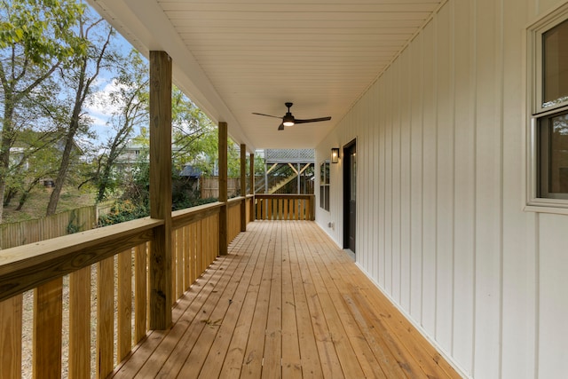 wooden terrace featuring ceiling fan