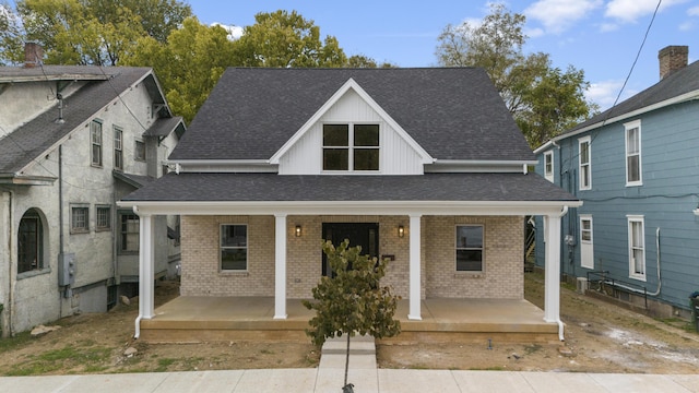 323 Conway St, Frankfort, KY 40601 - view of front of home with brick siding, roof with shingles, and covered porch