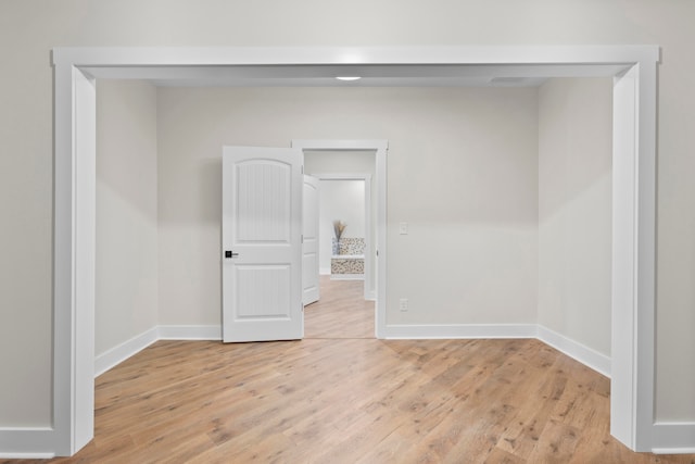 spare room featuring light hardwood / wood-style flooring