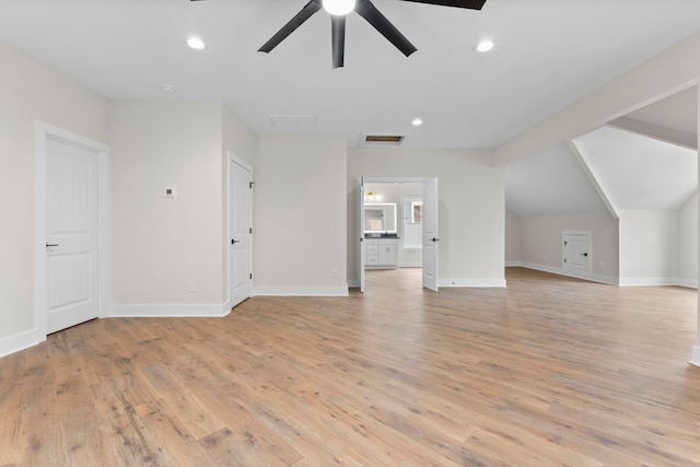 additional living space featuring lofted ceiling, light wood-type flooring, and ceiling fan