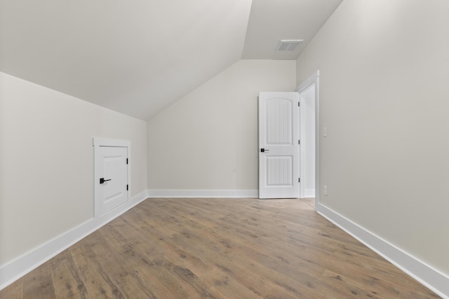 323 Conway St, Frankfort, KY 40601 - bonus room featuring lofted ceiling, visible vents, baseboards, and wood finished floors