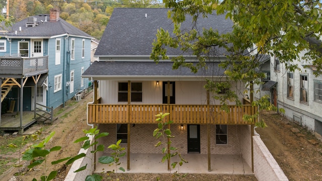 back of property with a patio