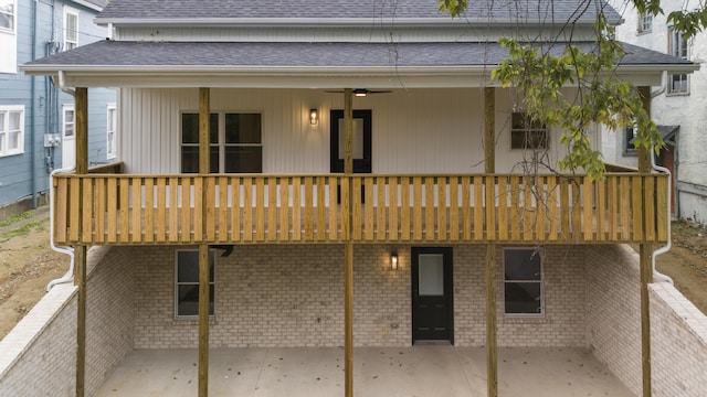 323 Conway St, Frankfort, KY 40601 - back of house with brick siding, a patio area, a shingled roof, and a wooden deck