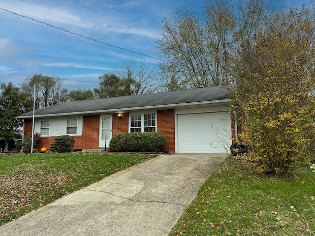 single story home with a front yard and a garage