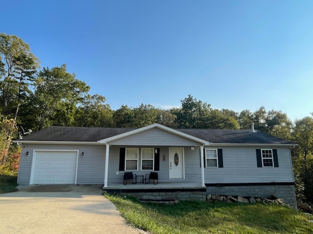 view of front of house with covered porch and a garage