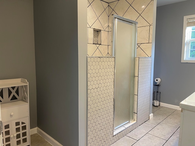 bathroom featuring walk in shower and tile patterned floors