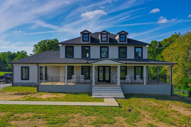 view of front of house with a porch and a front yard