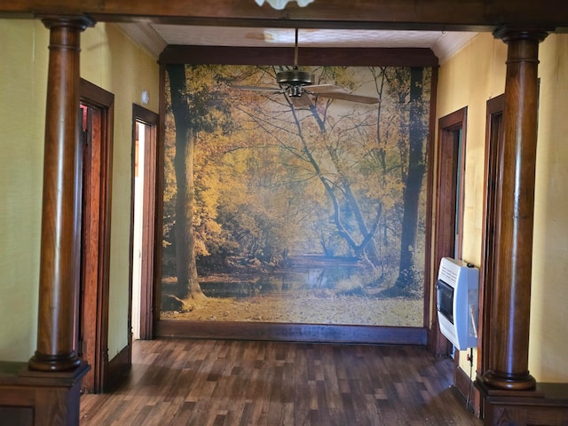 interior space featuring ceiling fan, beamed ceiling, dark hardwood / wood-style floors, and heating unit