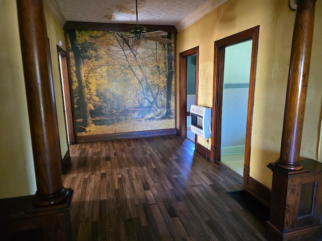 unfurnished dining area with dark wood-type flooring, heating unit, crown molding, and ceiling fan