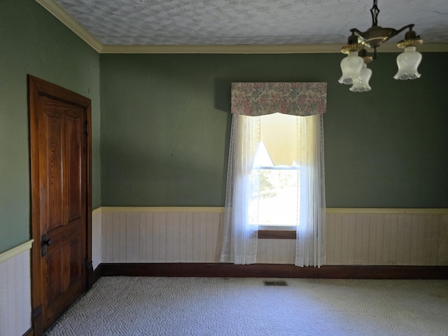595 Bethel Ridge Rd, Sharpsburg, KY 40374 - empty room featuring radiator, a chandelier, carpet, a wainscoted wall, and ornamental molding