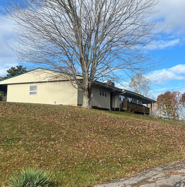 view of property exterior featuring a yard