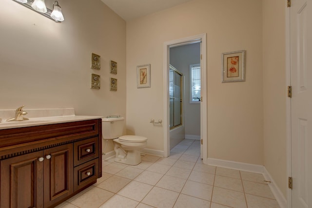 full bathroom with tile patterned flooring, vanity, toilet, and bath / shower combo with glass door