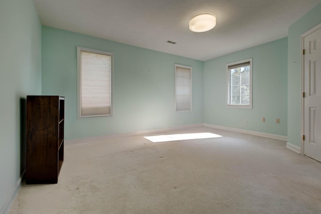 unfurnished bedroom with light carpet