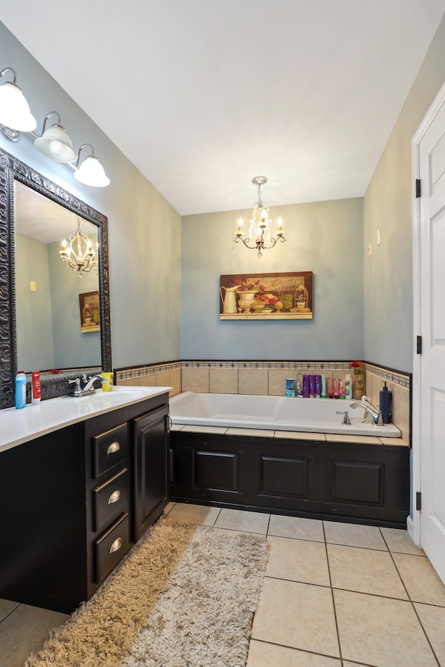 bathroom with tile patterned floors, a tub, and a notable chandelier