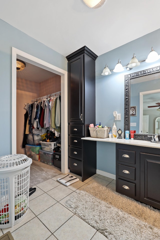 bathroom featuring tile patterned floors, ceiling fan, and vanity