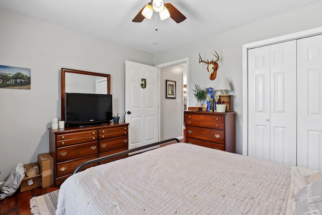 bedroom featuring dark hardwood / wood-style flooring, a closet, and ceiling fan