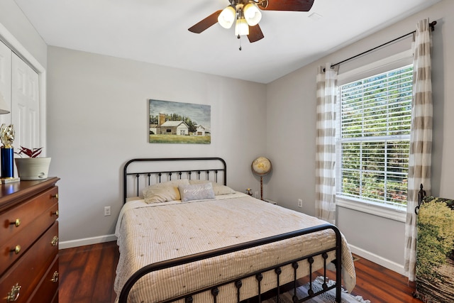 bedroom featuring a closet, ceiling fan, and dark hardwood / wood-style flooring