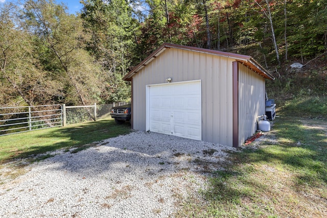 garage with a lawn