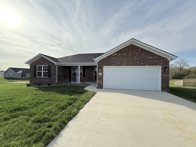 267 Brook Cv, Berea, KY 40403 - ranch-style house with brick siding, concrete driveway, a garage, and a front lawn