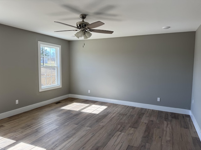 218 Little Acres Rd, Lily, KY 40740 - spare room featuring dark wood-style flooring, baseboards, and a ceiling fan