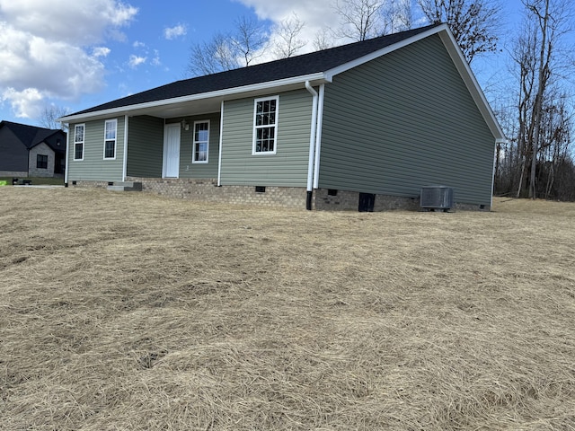 back of house featuring crawl space and central AC