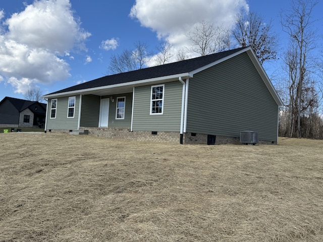 view of front facade featuring crawl space and central air condition unit