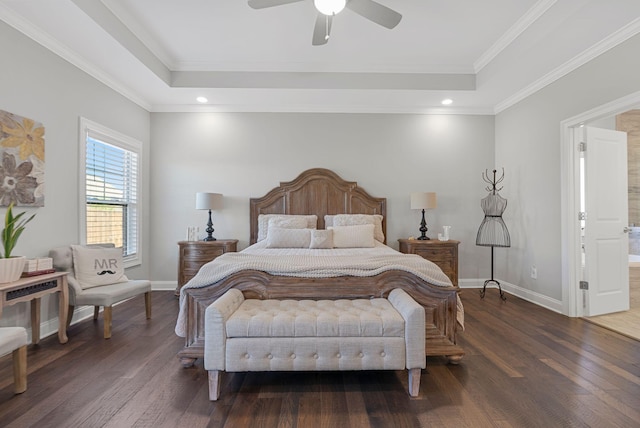 bedroom featuring ceiling fan, ensuite bath, dark hardwood / wood-style floors, and crown molding