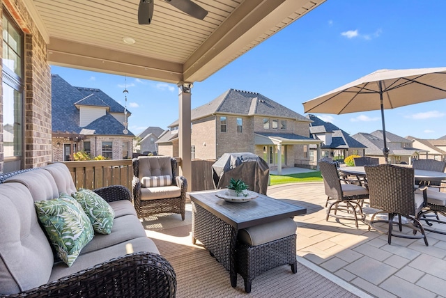 view of patio / terrace with ceiling fan, an outdoor living space, and grilling area