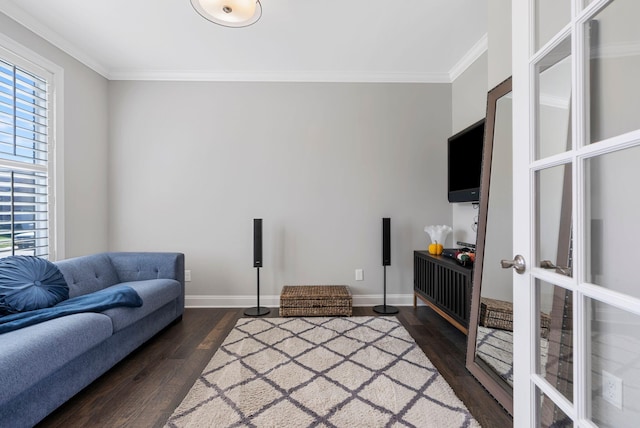 living room with french doors, crown molding, and dark wood-type flooring