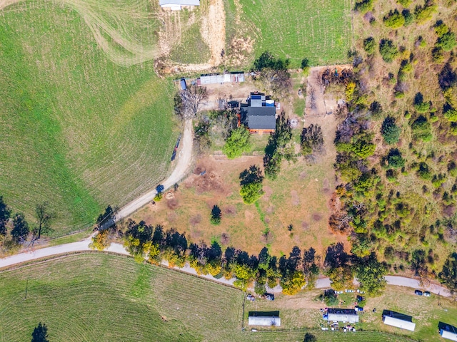 birds eye view of property with a rural view