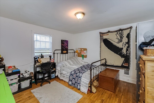 bedroom featuring wood-type flooring