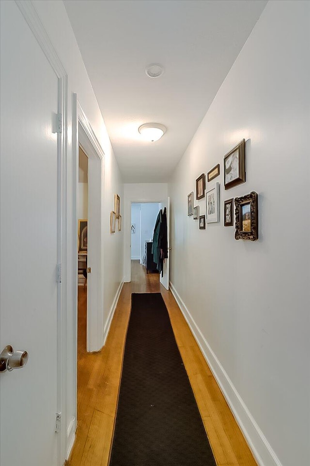 hall with light hardwood / wood-style floors