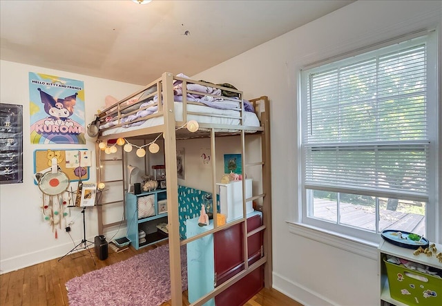 bedroom with hardwood / wood-style flooring