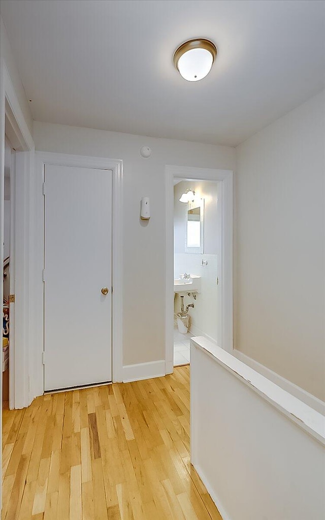 hallway with light wood-type flooring