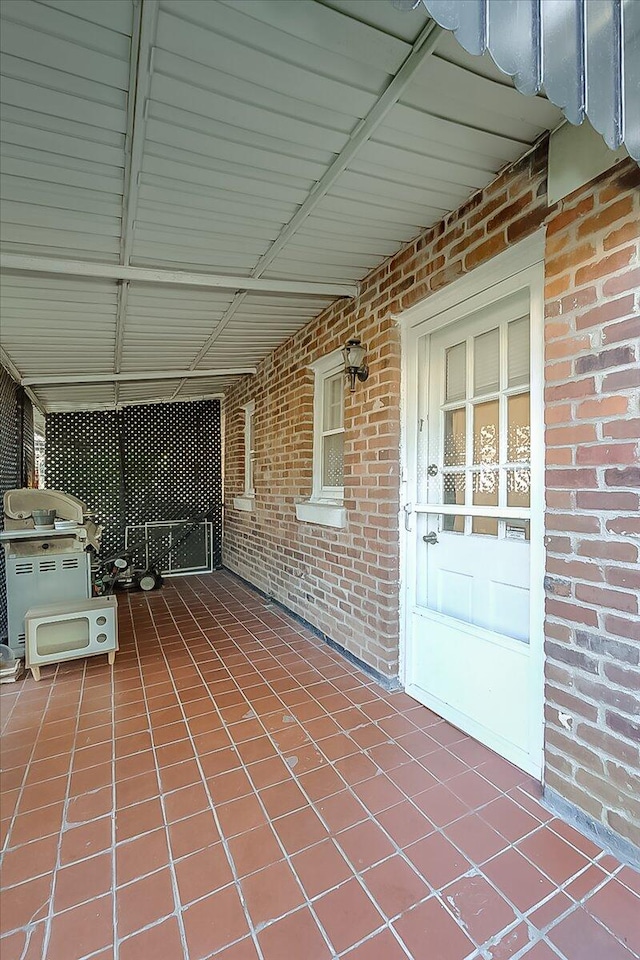 view of patio featuring a grill