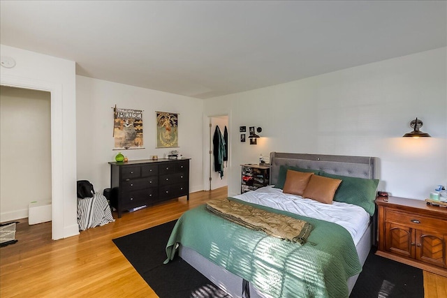 bedroom with wood-type flooring