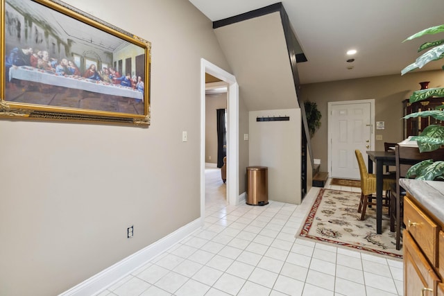 interior space with light tile patterned floors, baseboards, and recessed lighting