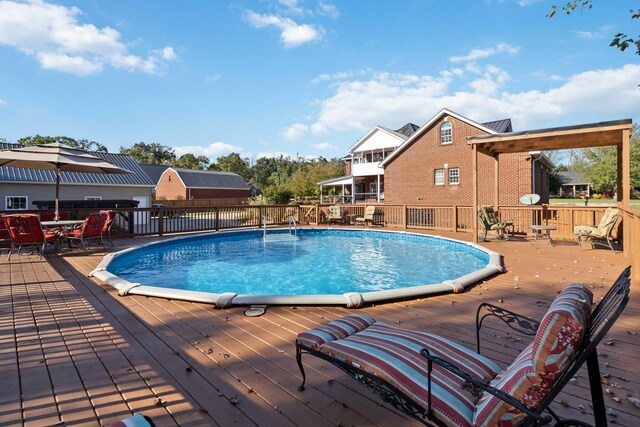 view of swimming pool featuring a fenced in pool and fence