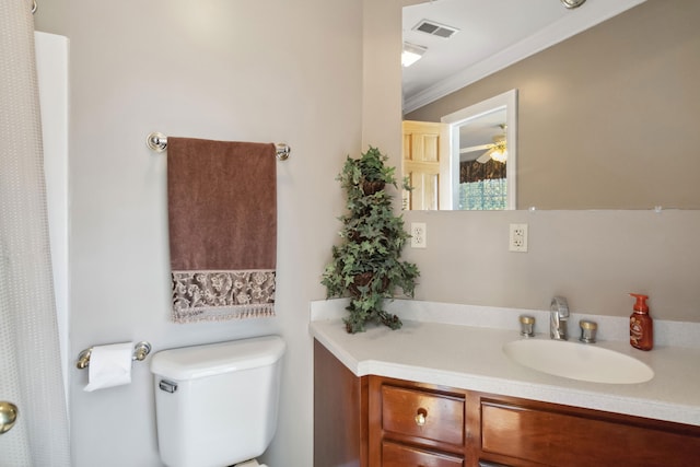 bathroom featuring vanity, ornamental molding, a ceiling fan, visible vents, and toilet