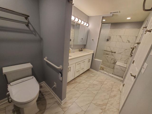 bathroom with vanity, toilet, and a shower with shower door