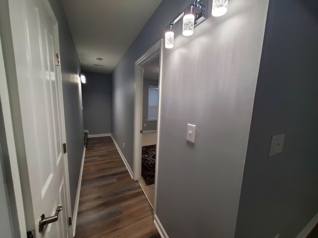 hallway featuring dark hardwood / wood-style flooring