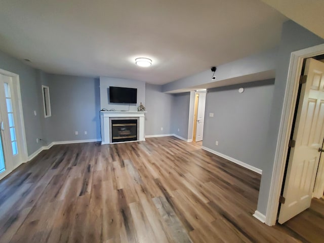 unfurnished living room featuring hardwood / wood-style floors